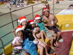 A nice Japanese family gets in the Christmas spirit (thanks to Krash's bag-o-xmas hats)